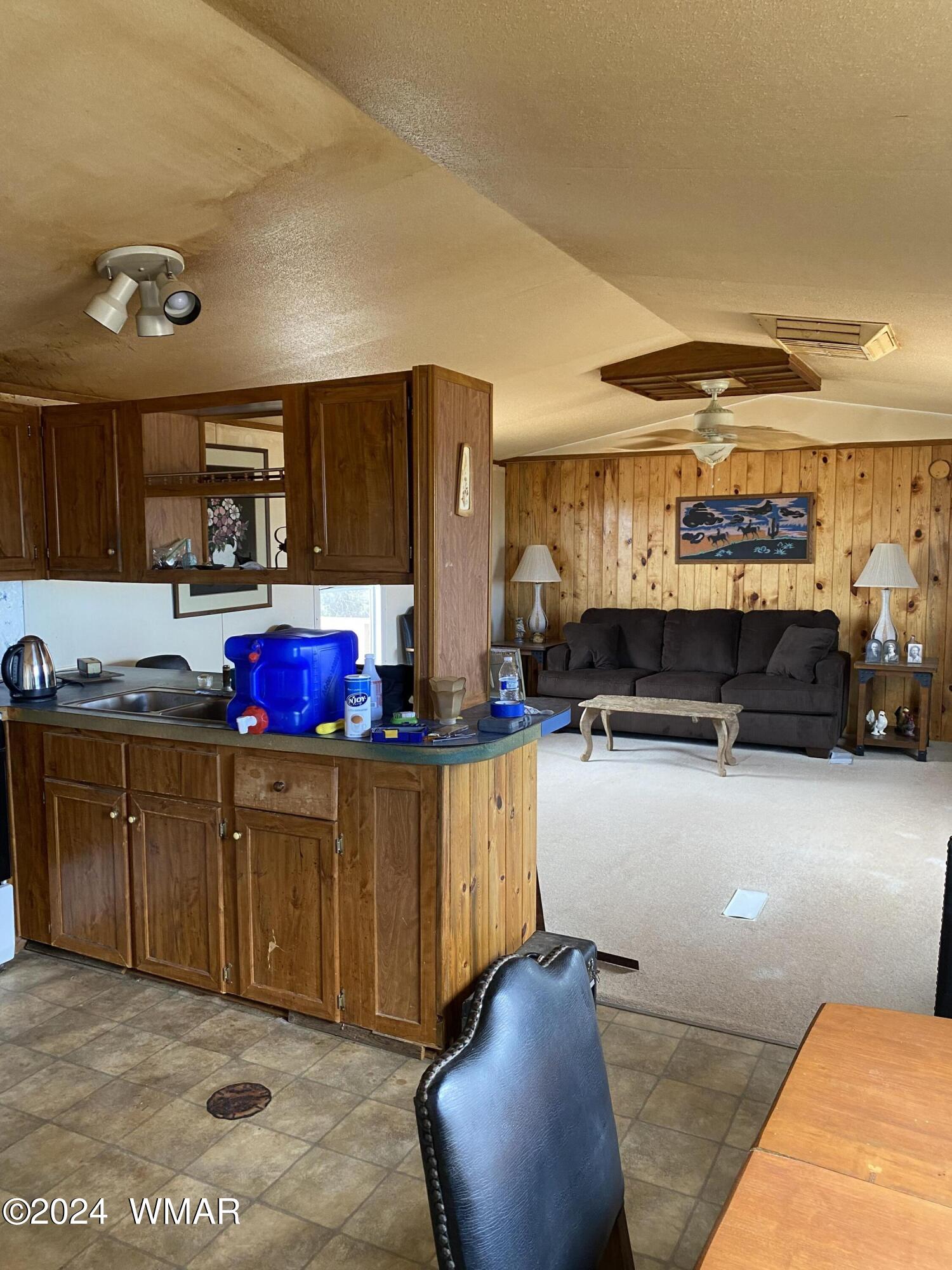 5149 Pj Ranch Road Snowflake, AZ 85937 - Photo 19 of 44 a kitchen with stainless steel appliances kitchen island granite countertop a stove and cabinets