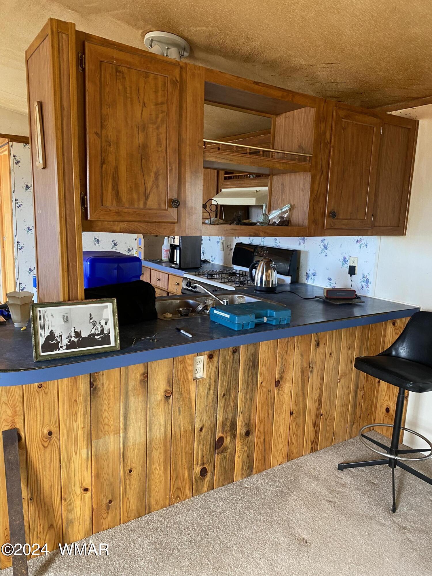 5149 Pj Ranch Road Snowflake, AZ 85937 - Photo 20 of 44 a kitchen with stainless steel appliances a stove a sink and a microwave
