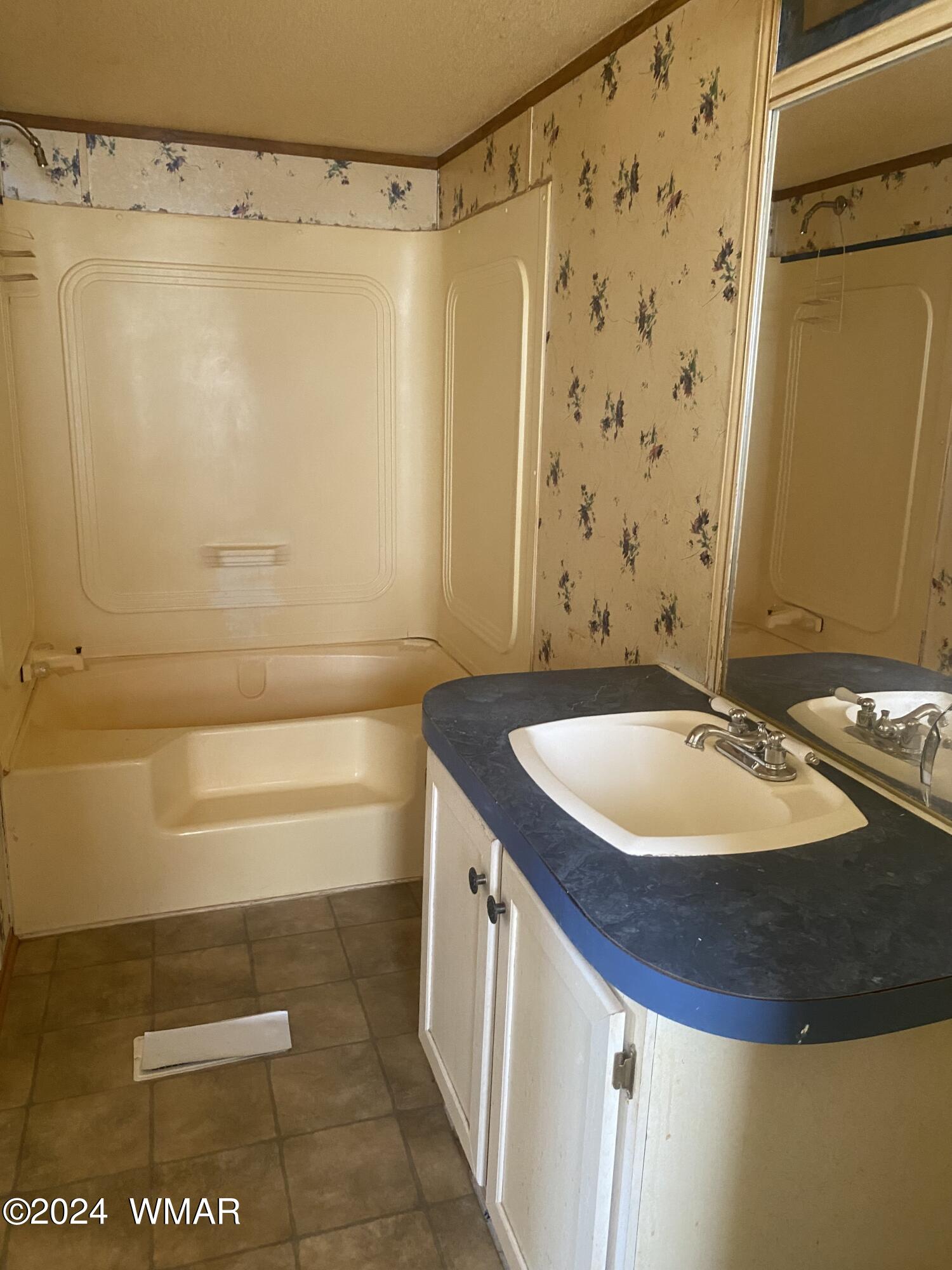 5149 Pj Ranch Road Snowflake, AZ 85937 - Photo 25 of 44 a bathroom with a sink and a mirror
