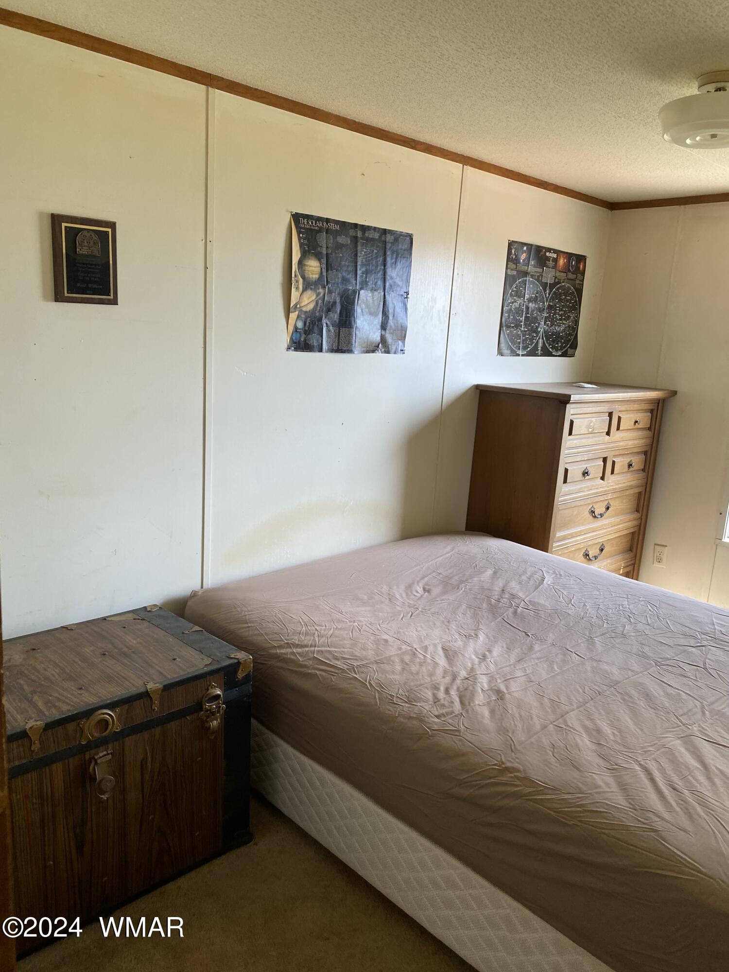 5149 Pj Ranch Road Snowflake, AZ 85937 - Photo 30 of 44 a bedroom with a bed and wooden floor