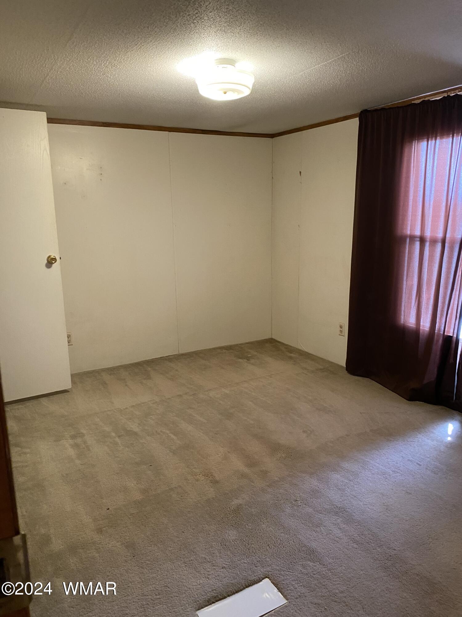 5149 Pj Ranch Road Snowflake, AZ 85937 - Photo 35 of 44 an empty room with a window