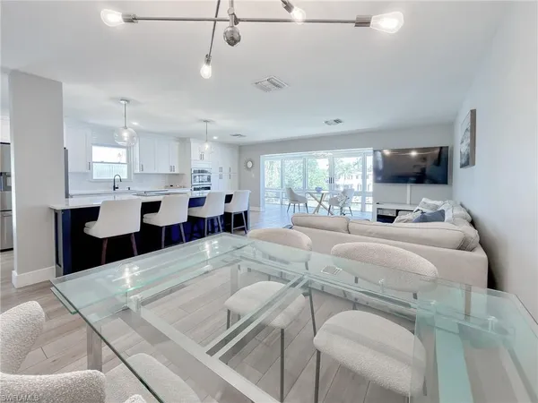 a large white kitchen with lots of counter space