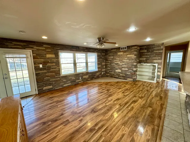 a view of a livingroom with wooden floor