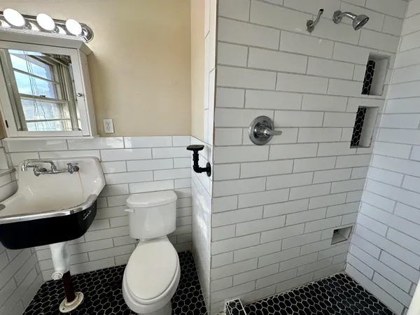 a bathroom with a toilet and a sink