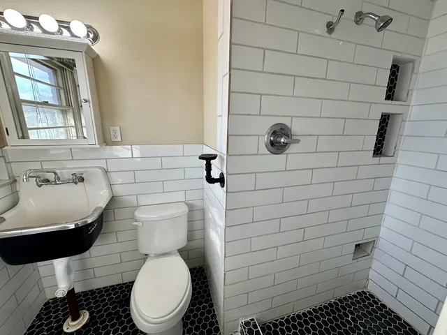 a bathroom with a toilet and a sink