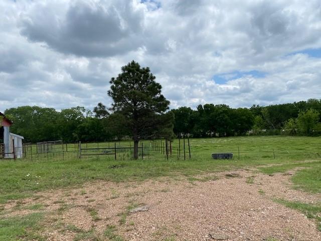 a view of outdoor space with green field and trees
