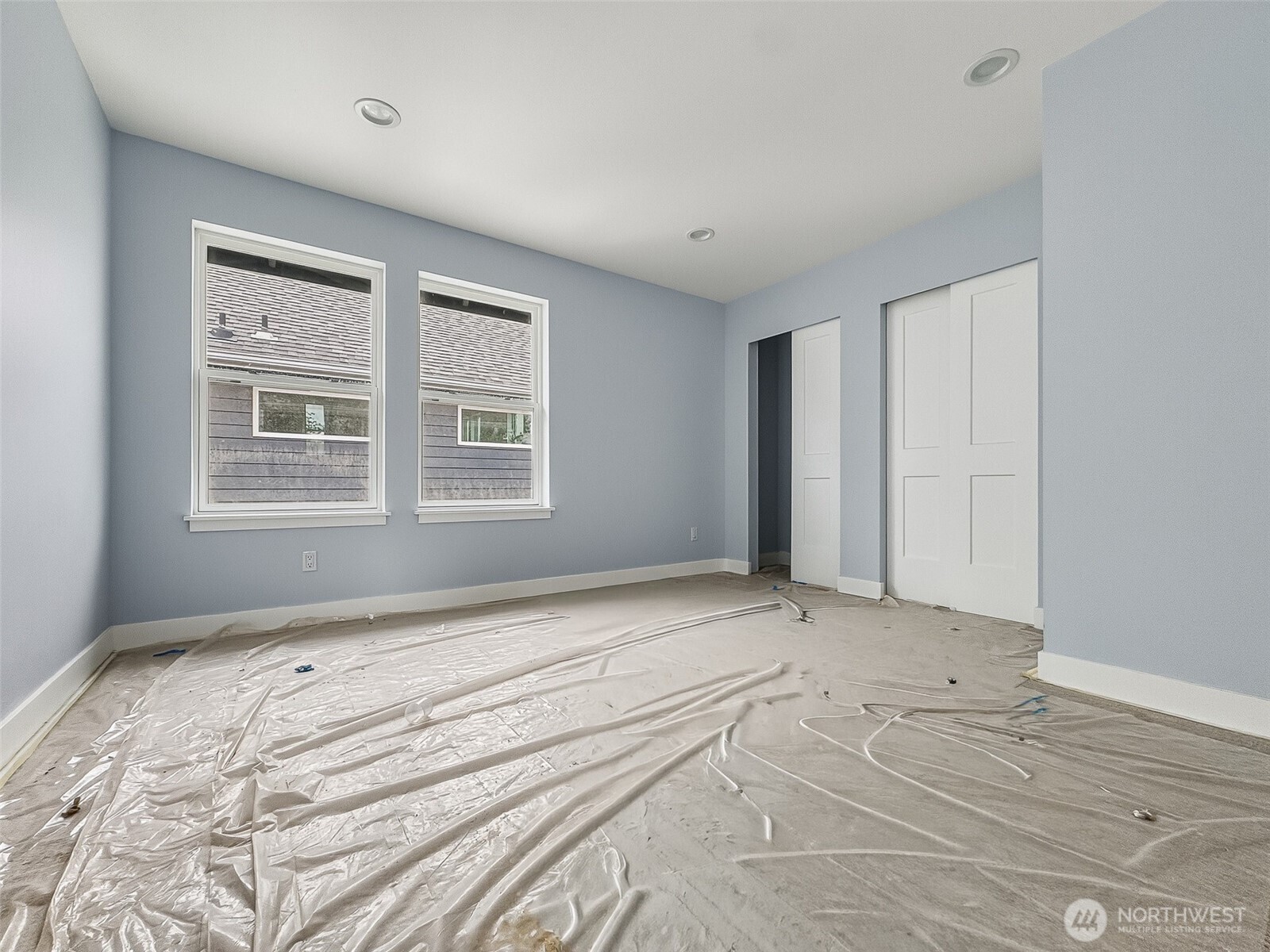 2317 22nd Avenue South Seattle, WA 98144 - Photo 19 of 29 a view of an empty room with wooden floor and a window