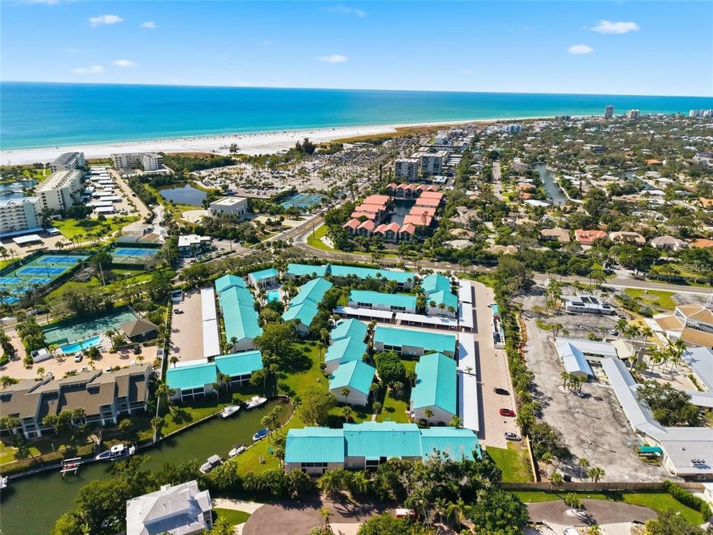 5631 Midnight Pass Road, Unit 1002 Sarasota, FL 34242 - Photo 4 of 30 an aerial view of multiple house