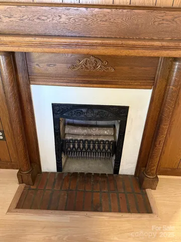 a view of fireplace and wooden floor