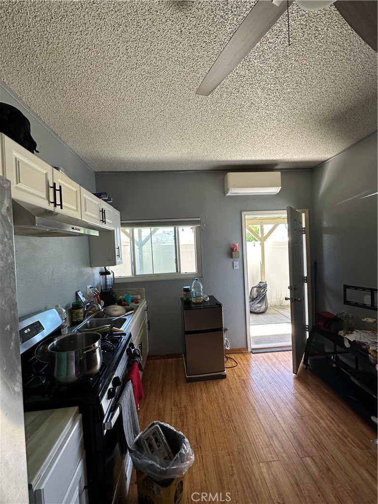 26326 Investors Hemet, CA 92544 - Photo 14 of 16 a living room with furniture and wooden floor