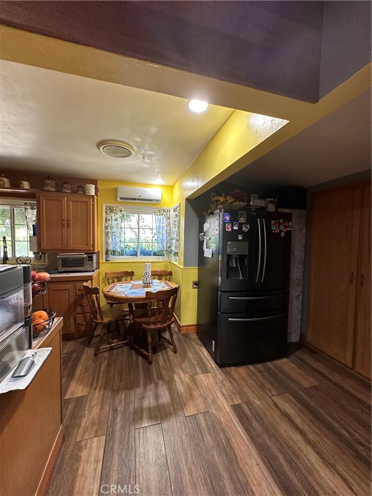 26326 Investors Hemet, CA 92544 - Photo 2 of 16 a kitchen view of a table and chairs in patio