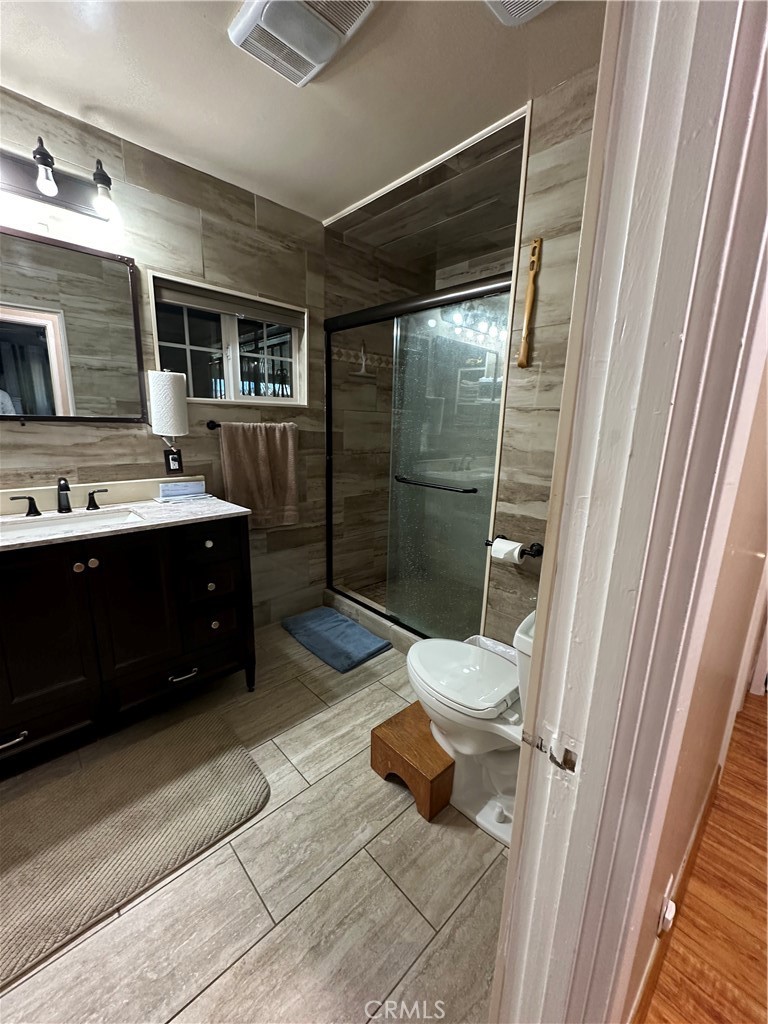 26326 Investors Hemet, CA 92544 - Photo 5 of 16 a bathroom with a sink and mirror
