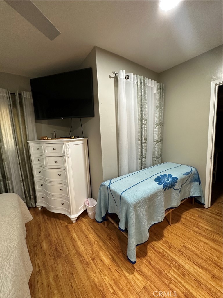 26326 Investors Hemet, CA 92544 - Photo 7 of 16 a bedroom with a bed tv and a window