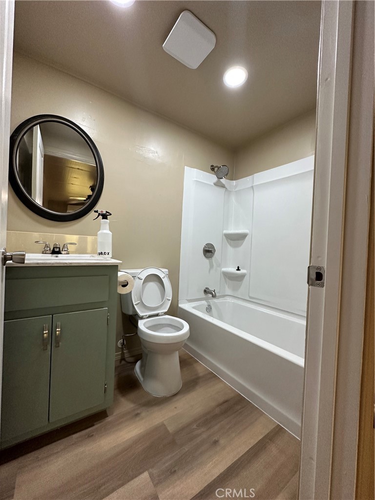 26326 Investors Hemet, CA 92544 - Photo 10 of 16 a bathroom with a toilet a sink and bathtub