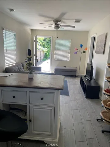 a kitchen with a sink and a stove top oven
