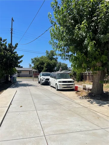 a view of street with parked cars