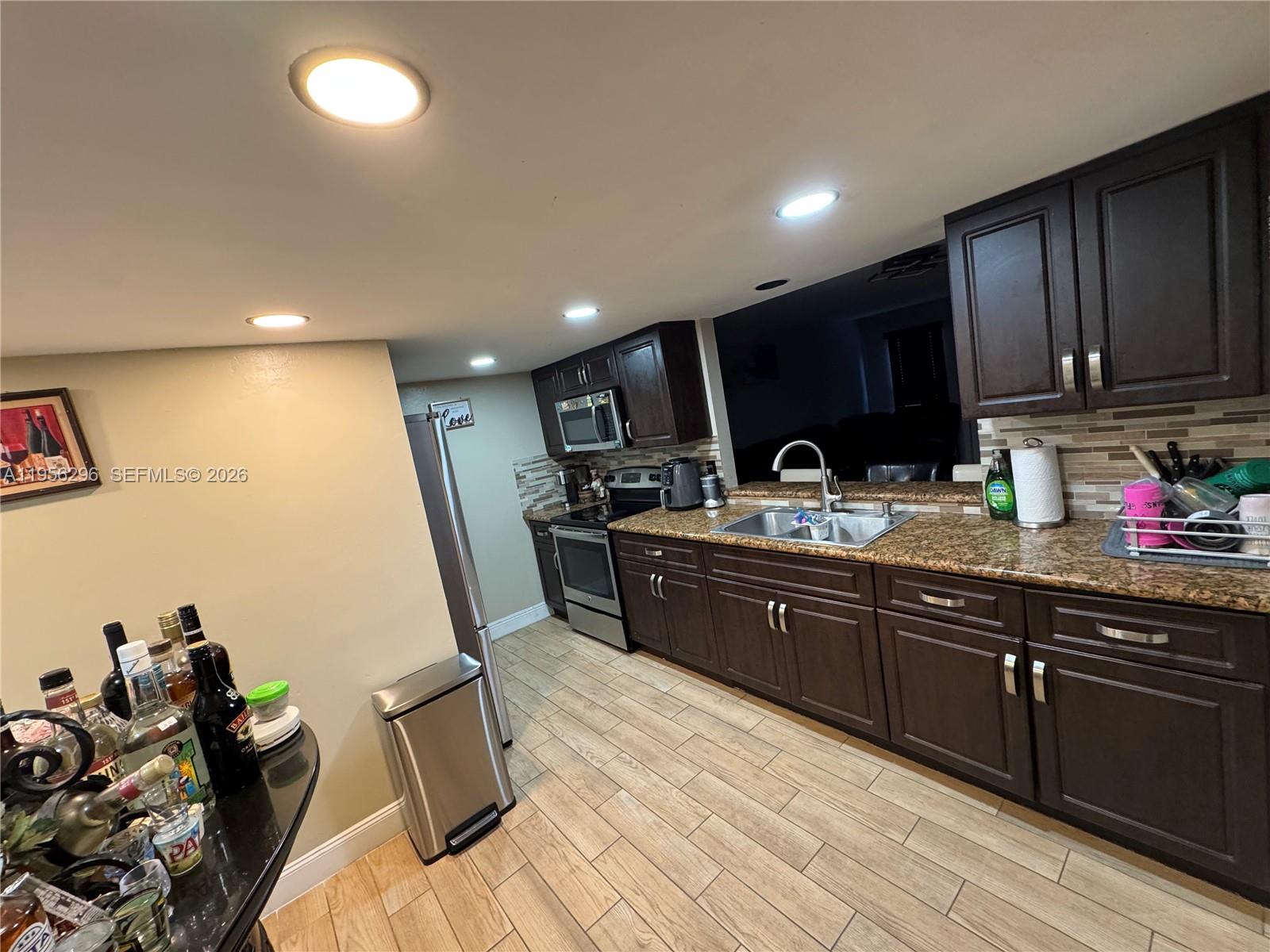 9412 Northwest 39th Street Sunrise, FL 33351 - Photo 13 of 23 a kitchen with granite countertop lots of counter top space
