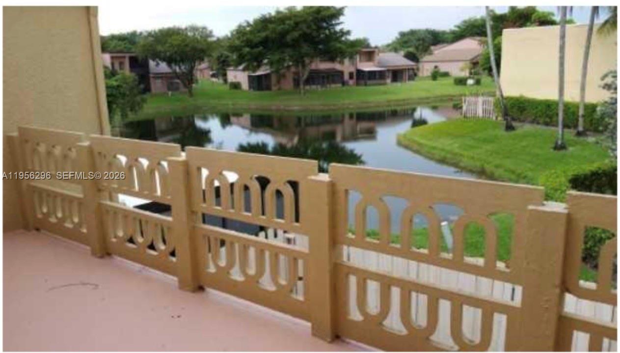 9412 Northwest 39th Street Sunrise, FL 33351 - Photo 3 of 23 a view of a house with a yard and lake view