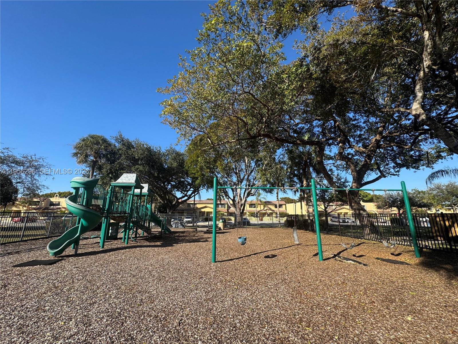 9412 Northwest 39th Street Sunrise, FL 33351 - Photo 5 of 23 a street view with tall trees