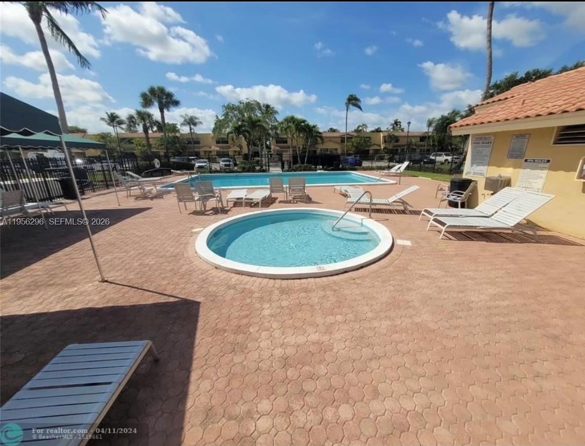 9412 Northwest 39th Street Sunrise, FL 33351 - Photo 9 of 23 a view of a swimming pool with a patio