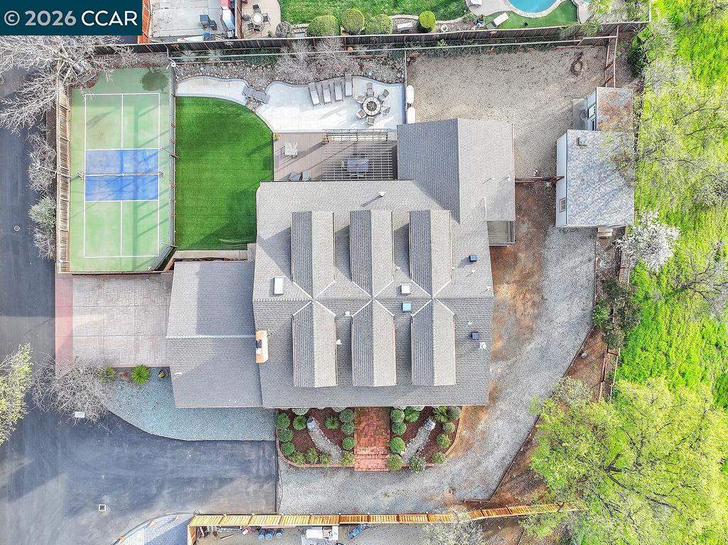 an aerial view of a house with a yard