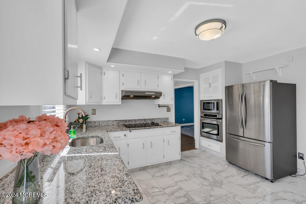 6 Firethorne Road Cherry Hill, NJ 08003 - Photo 16 of 52 a kitchen with stainless steel appliances granite countertop a sink a stove a refrigerator and cabinets