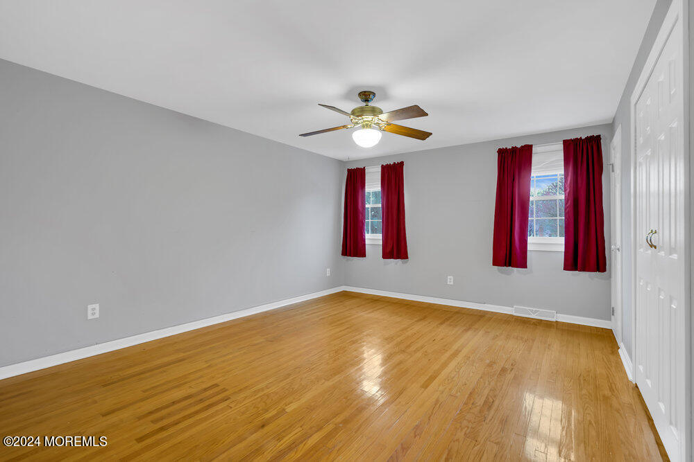 6 Firethorne Road Cherry Hill, NJ 08003 - Photo 23 of 52 a view of empty room with wooden floor and fan