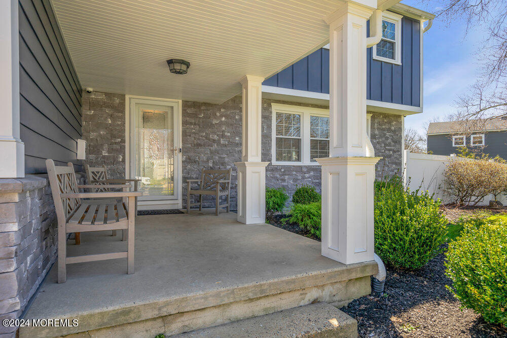 6 Firethorne Road Cherry Hill, NJ 08003 - Photo 4 of 52 a view of a brick house with a chairs and table in a patio