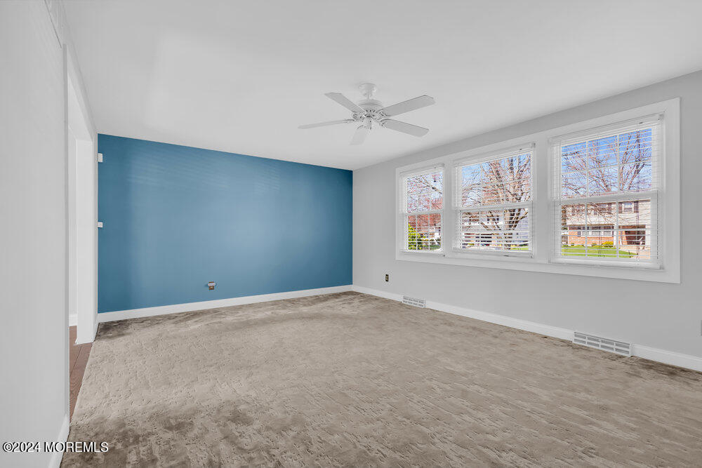 6 Firethorne Road Cherry Hill, NJ 08003 - Photo 7 of 52 an empty room with windows and ceiling fan