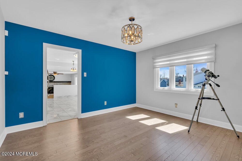 6 Firethorne Road Cherry Hill, NJ 08003 - Photo 10 of 52 a view of empty room with a window and wooden floor