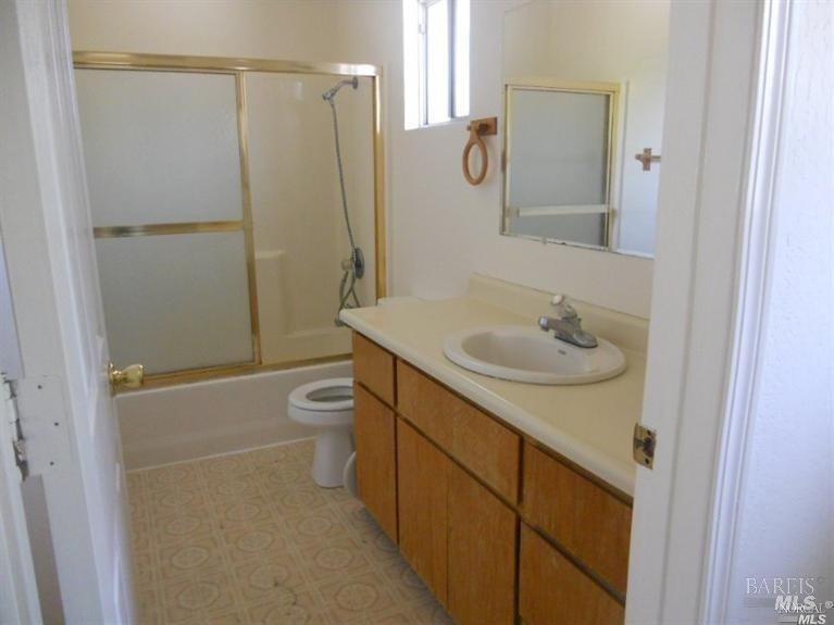 420 Montezuma Street, Unit C Rio Vista, CA 94571 - Photo 5 of 7 a bathroom with a sink a toilet and shower
