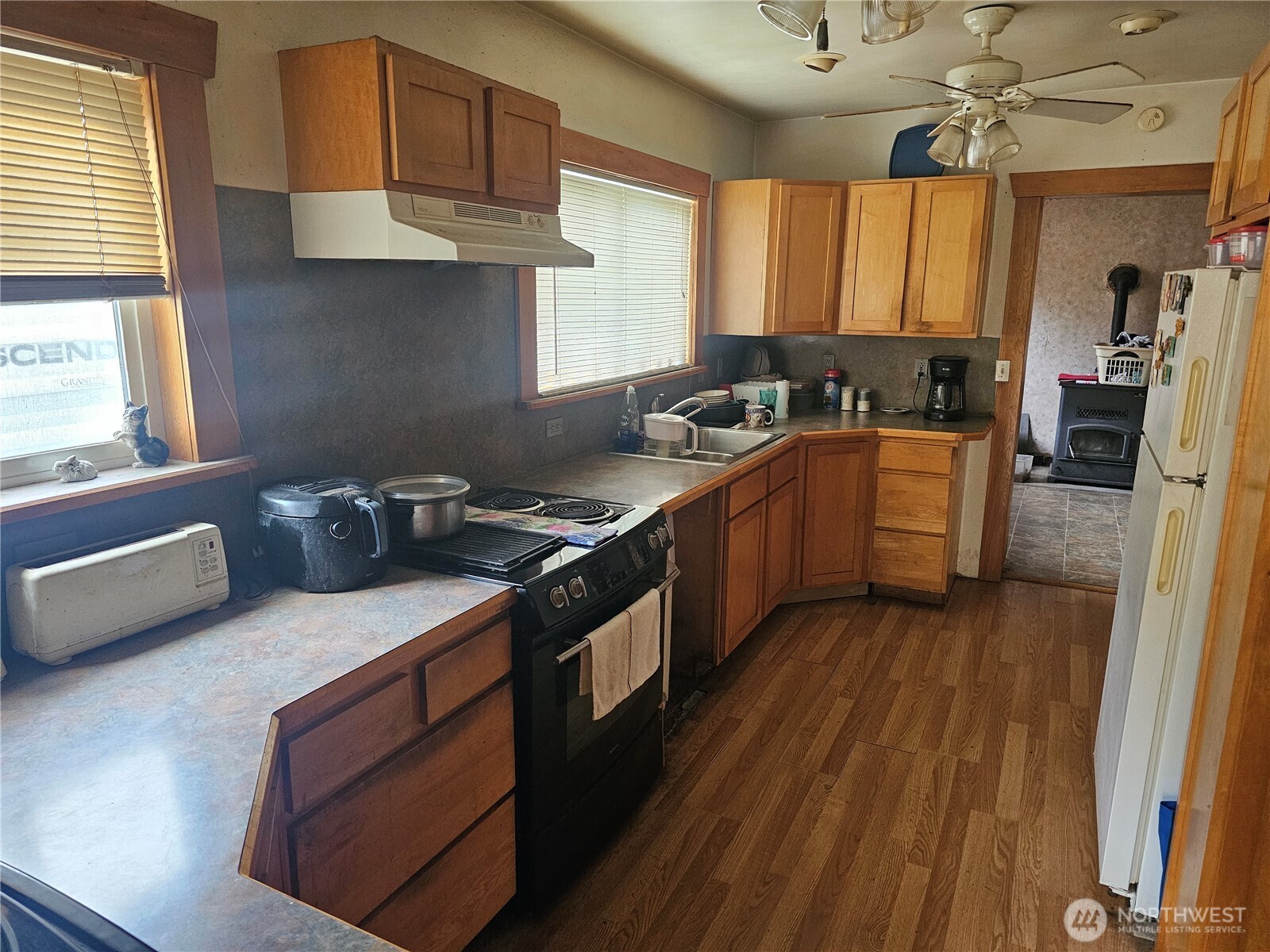 5390 Highway 12 Elma, WA 98541 - Photo 3 of 12 a kitchen with stainless steel appliances granite countertop a stove a sink dishwasher and a refrigerator