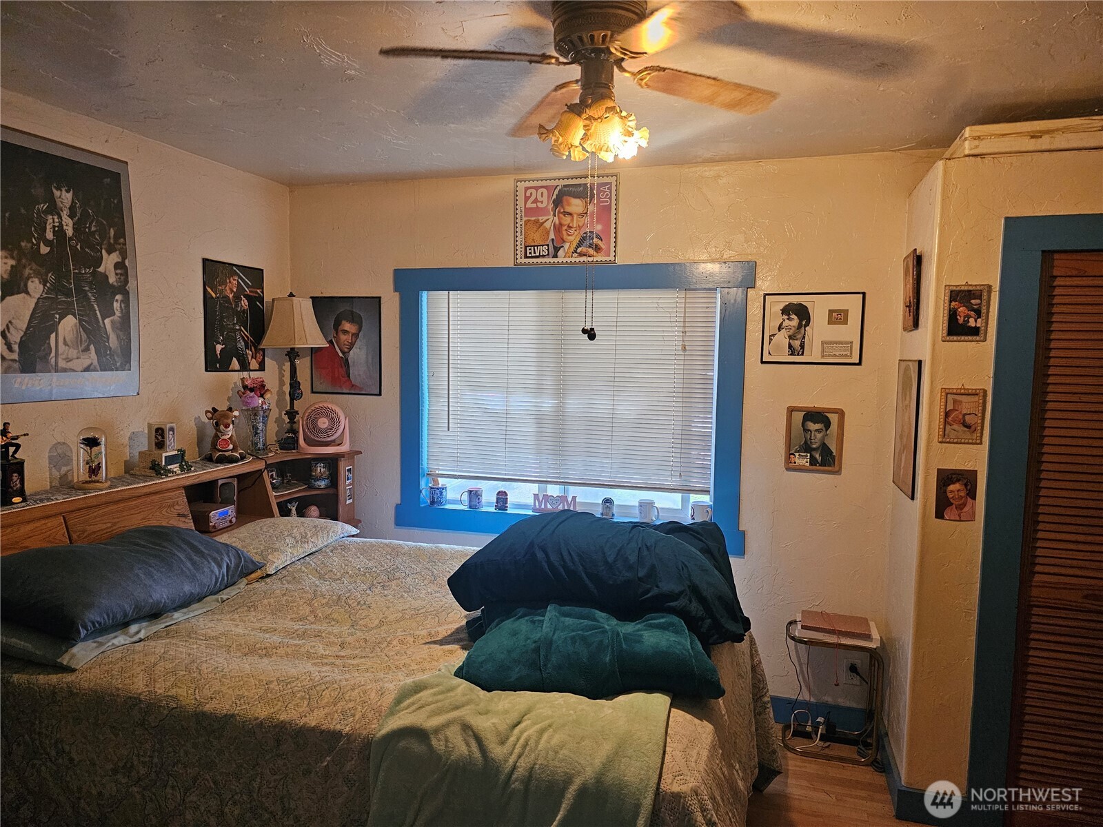 5390 Highway 12 Elma, WA 98541 - Photo 6 of 12 a bedroom with a bed and a chandelier