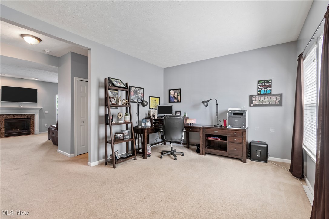 4467 Ridgestone Way Medina, OH 44256 - Photo 11 of 31 Carpeted office with a high end fireplace