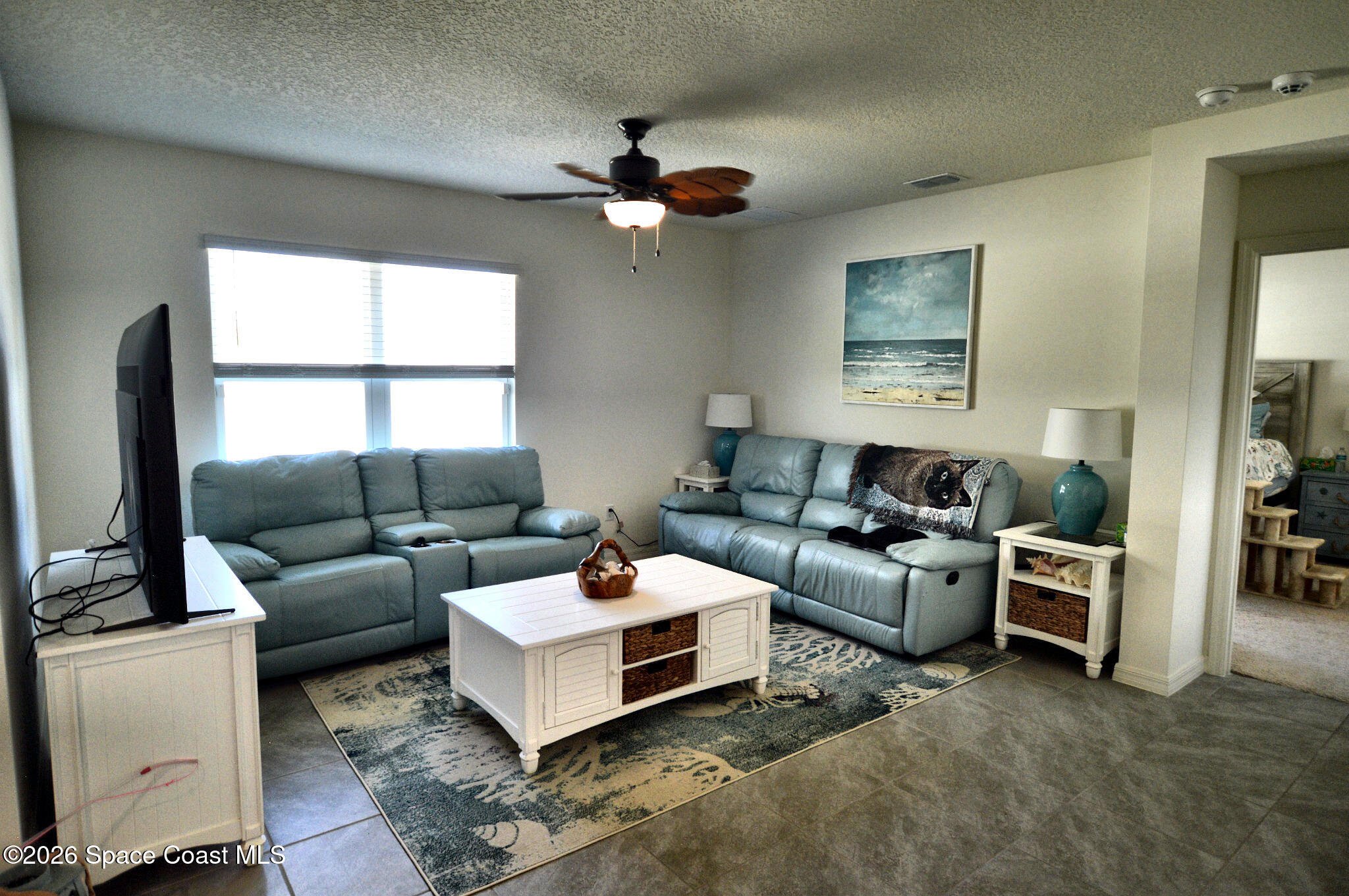 977 Trinity Street Rockledge, FL 32955 - Photo 11 of 18 a living room with furniture and a window