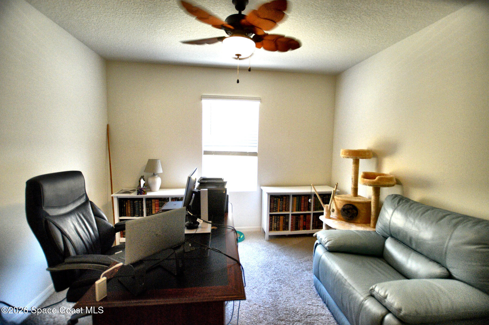 977 Trinity Street Rockledge, FL 32955 - Photo 13 of 18 a living room with furniture and a fireplace