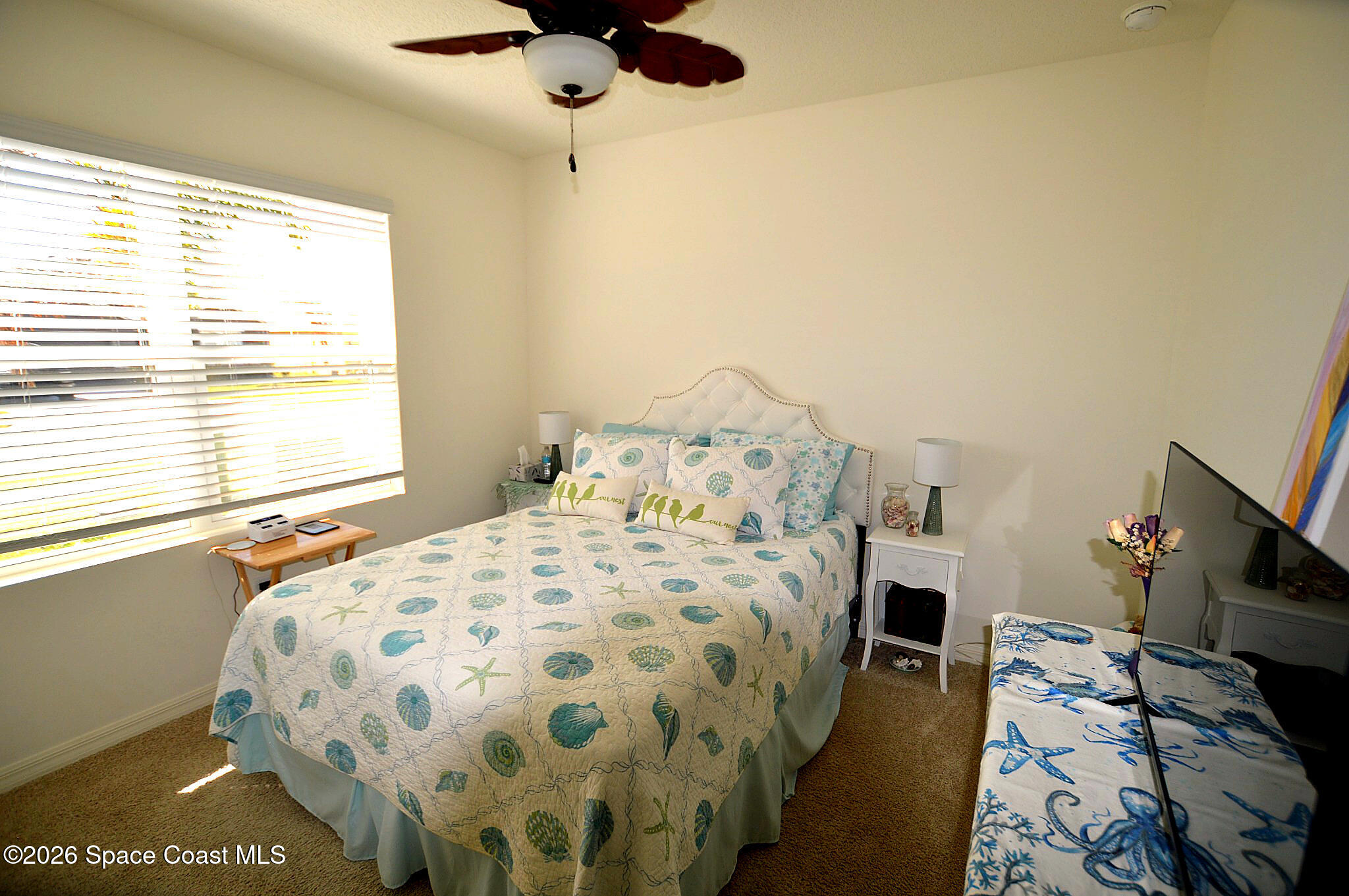 977 Trinity Street Rockledge, FL 32955 - Photo 14 of 18 a bedroom with a bed and a window