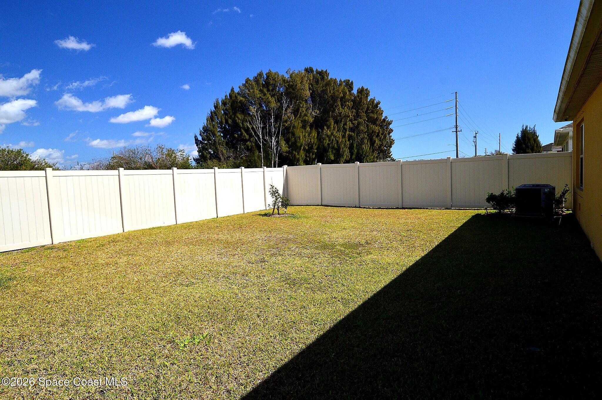 977 Trinity Street Rockledge, FL 32955 - Photo 4 of 18 a view of an outdoor space and swimming pool
