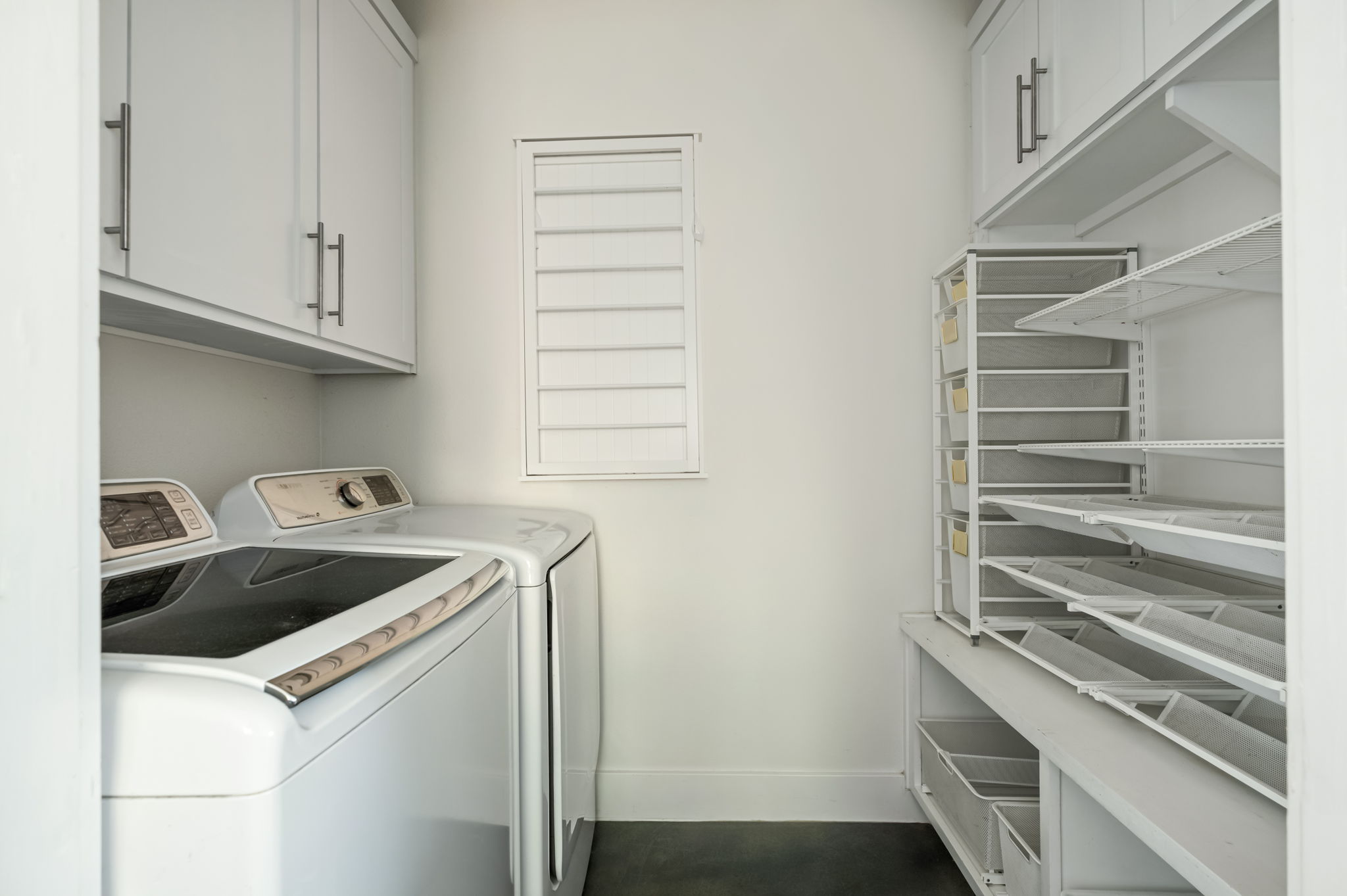1902 Webberville Road, Unit B Austin, TX 78721 - Photo 14 of 39 A dedicated laundry room provides convenience with contemporary appliances and ample storage solutions.