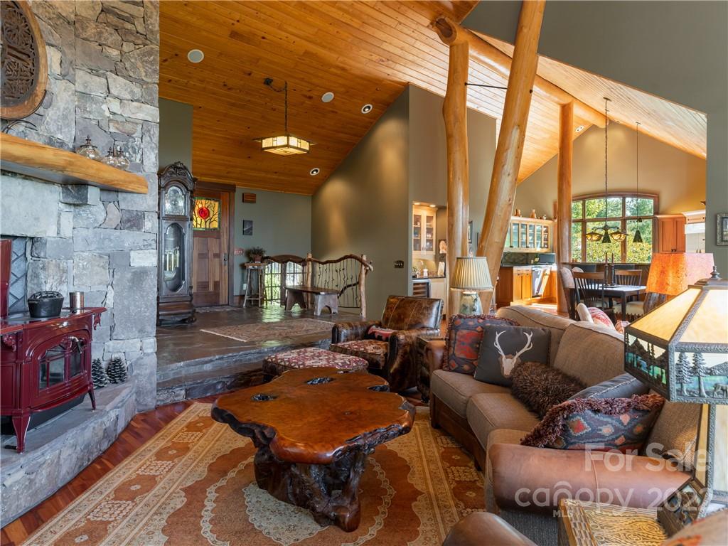 168 Pinkerton Corner Fairview, NC 28730 - Photo 12 of 48 a living room with furniture a large window and a fireplace