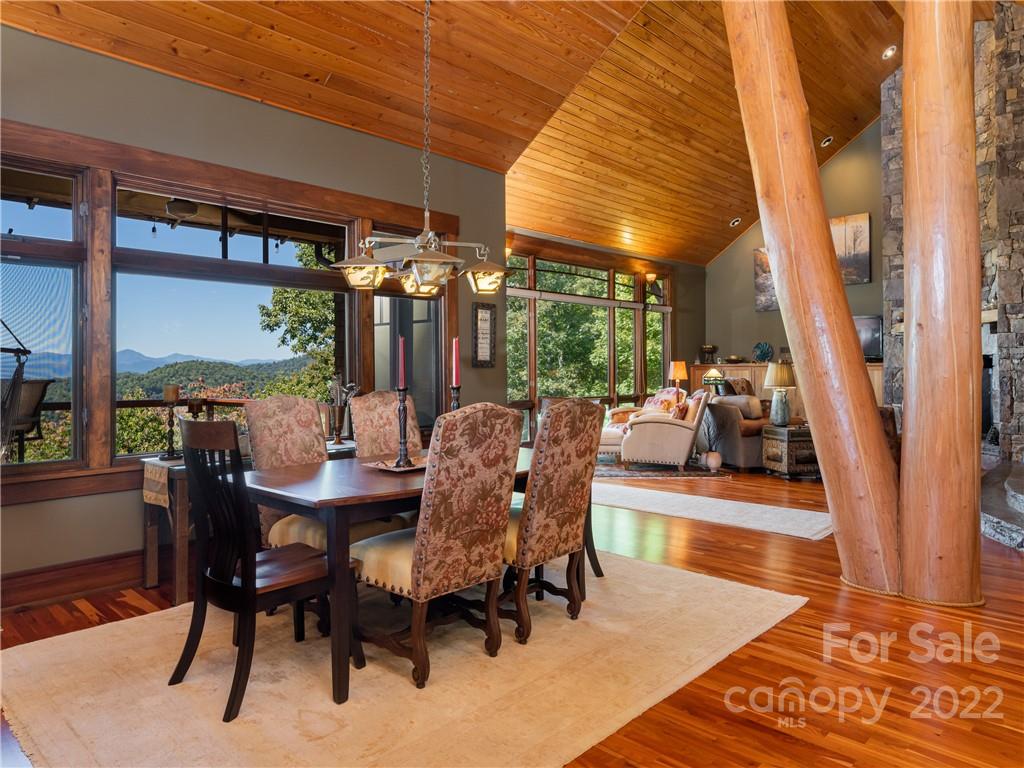 168 Pinkerton Corner Fairview, NC 28730 - Photo 13 of 48 a view of a dining room with furniture wooden floor and a rug