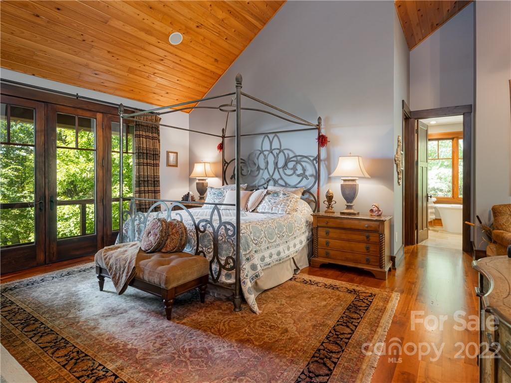 168 Pinkerton Corner Fairview, NC 28730 - Photo 19 of 48 a bedroom with furniture and a rug