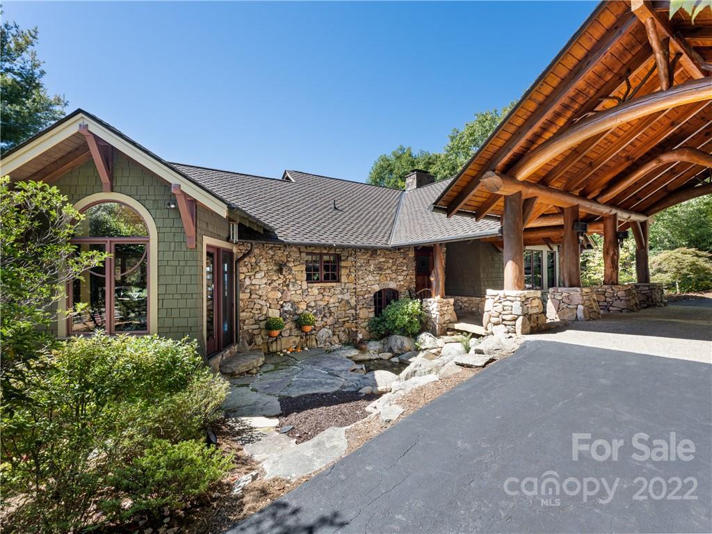 168 Pinkerton Corner Fairview, NC 28730 - Photo 2 of 48 a front view of house with yard outdoor seating and barbeque oven
