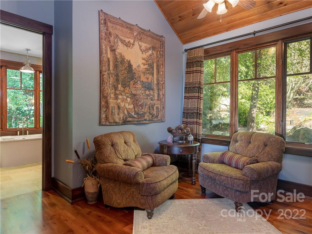 168 Pinkerton Corner Fairview, NC 28730 - Photo 21 of 48 a living room with furniture and a large window