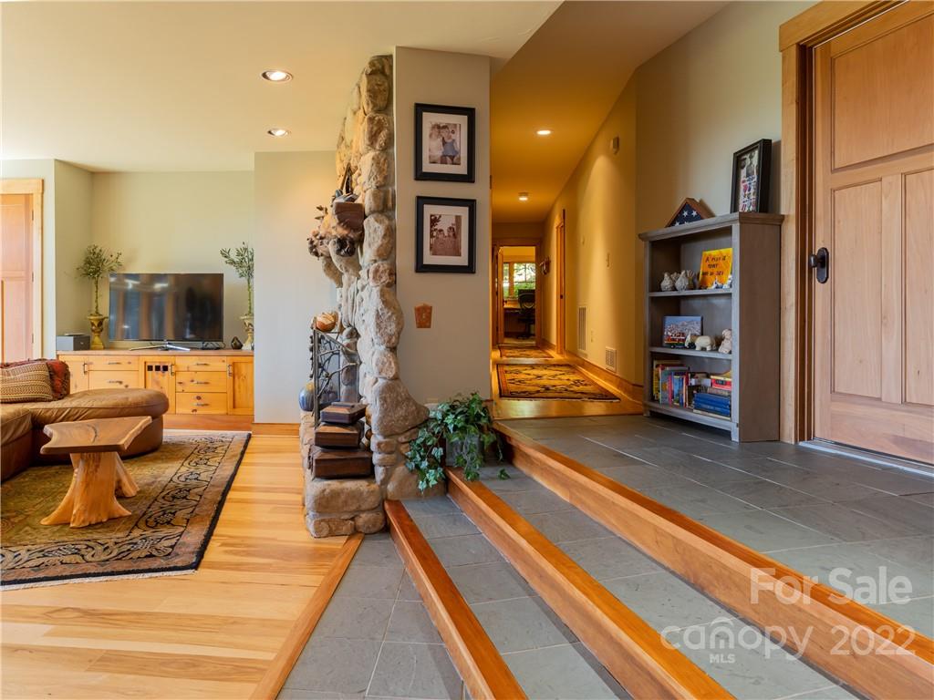 168 Pinkerton Corner Fairview, NC 28730 - Photo 30 of 48 a living room with furniture and a fireplace
