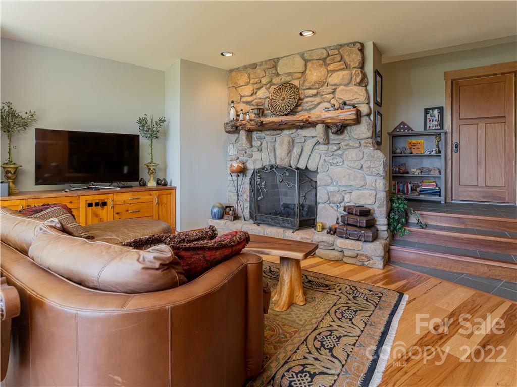 168 Pinkerton Corner Fairview, NC 28730 - Photo 32 of 48 a living room with furniture and a fireplace