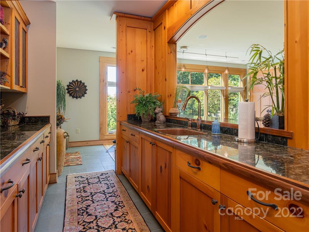 168 Pinkerton Corner Fairview, NC 28730 - Photo 35 of 48 a large kitchen with granite countertop a large window