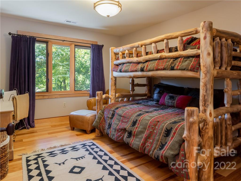 168 Pinkerton Corner Fairview, NC 28730 - Photo 36 of 48 a bedroom with a bed and large windows