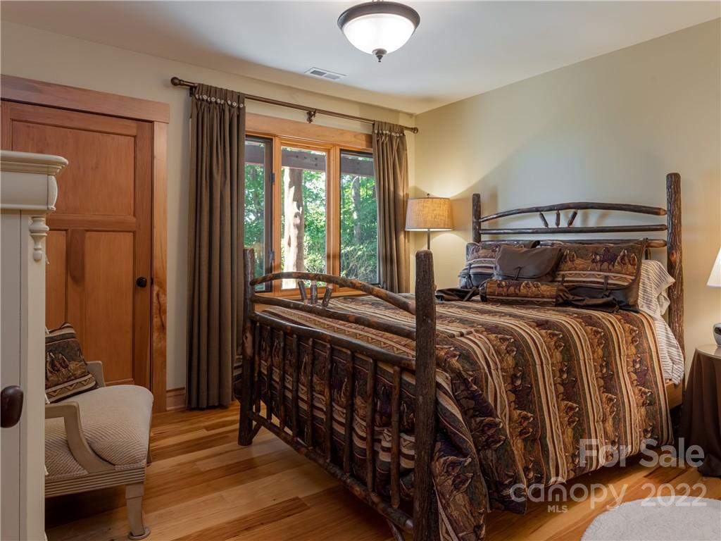 168 Pinkerton Corner Fairview, NC 28730 - Photo 38 of 48 a bedroom with a bed and a window