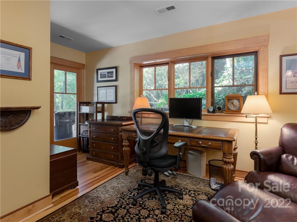 168 Pinkerton Corner Fairview, NC 28730 - Photo 39 of 48 a living room with furniture and a fireplace